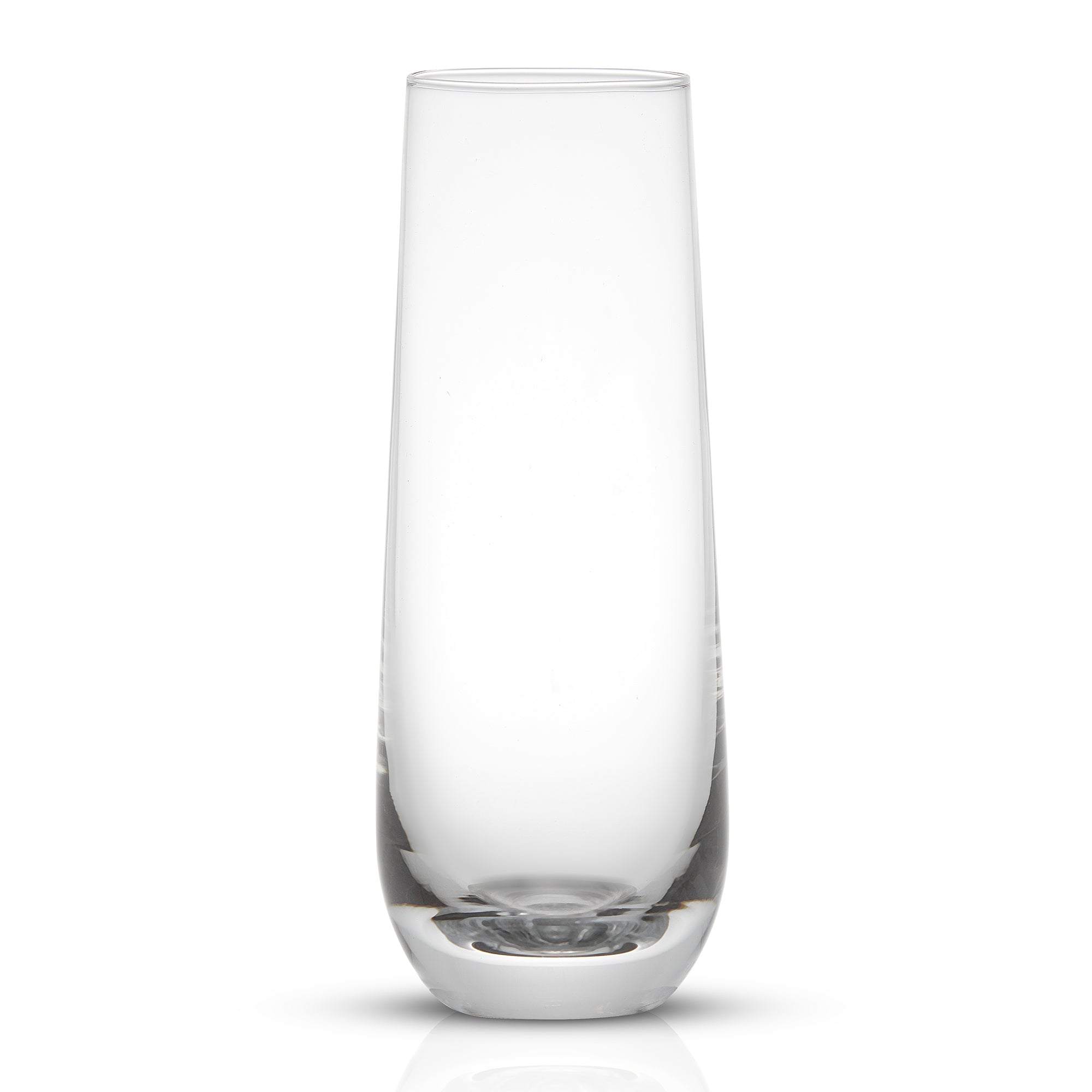 A clear, tall and slender champagne glass with a rounded base.