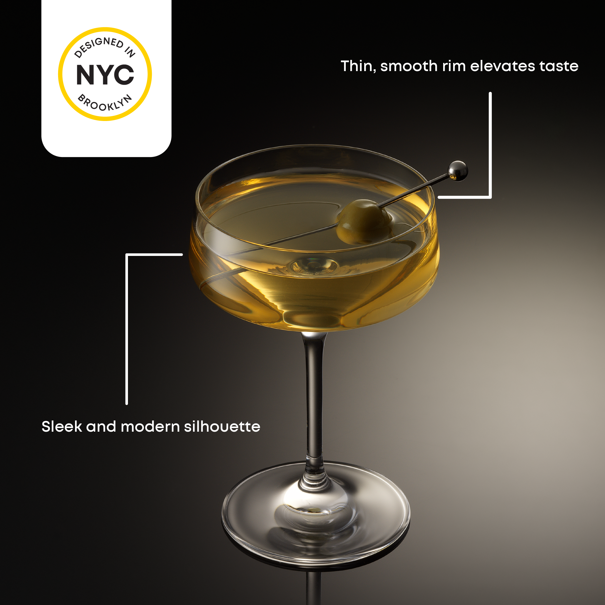 Cocktail glass with a thin, smooth rim on a dark background, featuring 'Designed in NYC Brooklyn' logo.