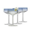 Four coupe glasses in ombre blue color.