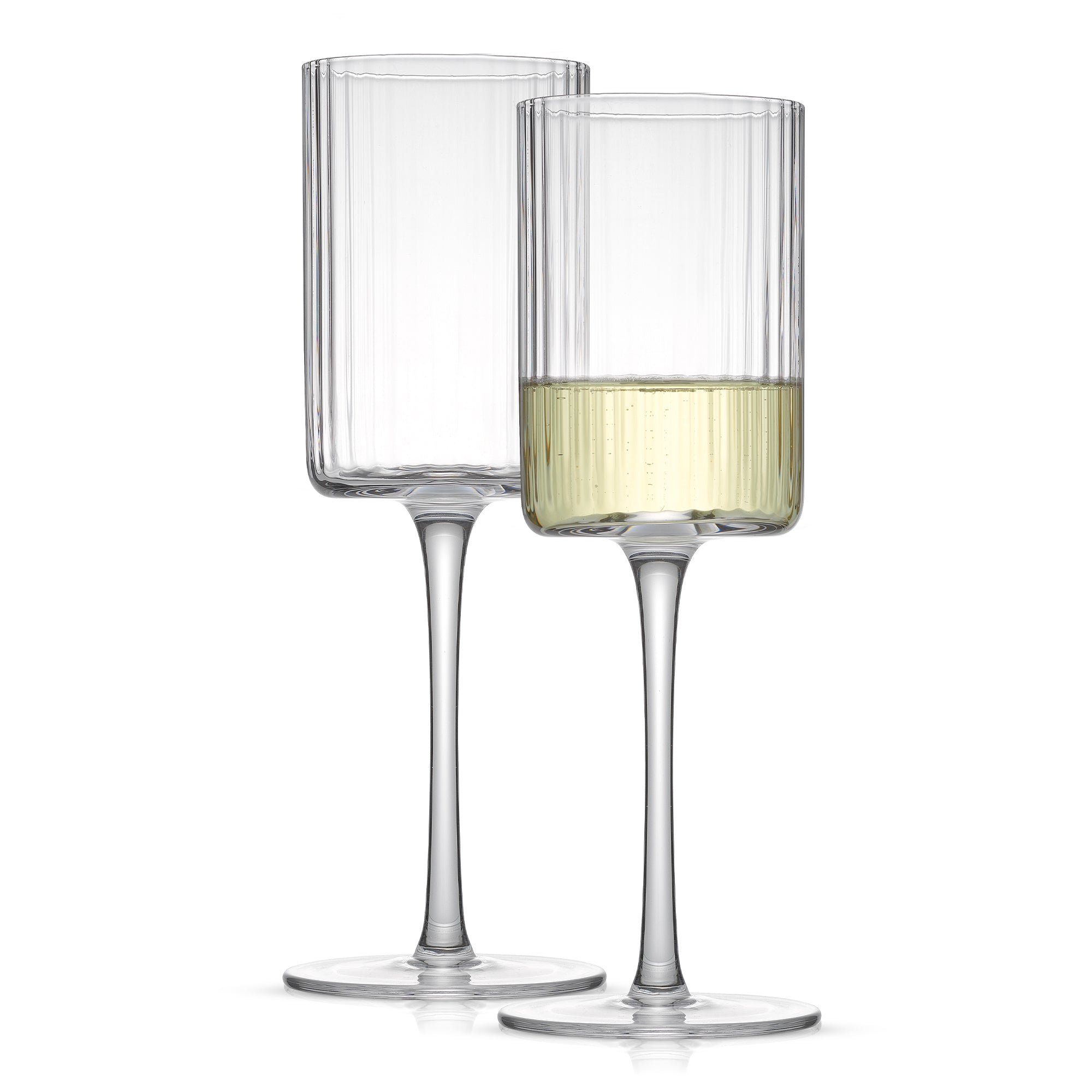 Two clear, tall and slender white wine glasses with a fluted design and a single stem. One glass is empty and the other is filled with a white wine.