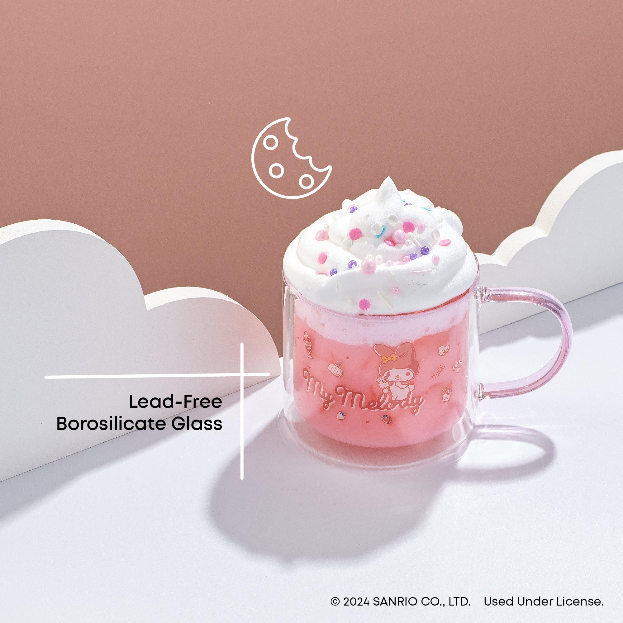 A pink glass mug with My Melody artwork. The mug is made of lead-free borosilicate glass. The artwork features My Melody, a pink cartoon rabbit character created by Sanrio.