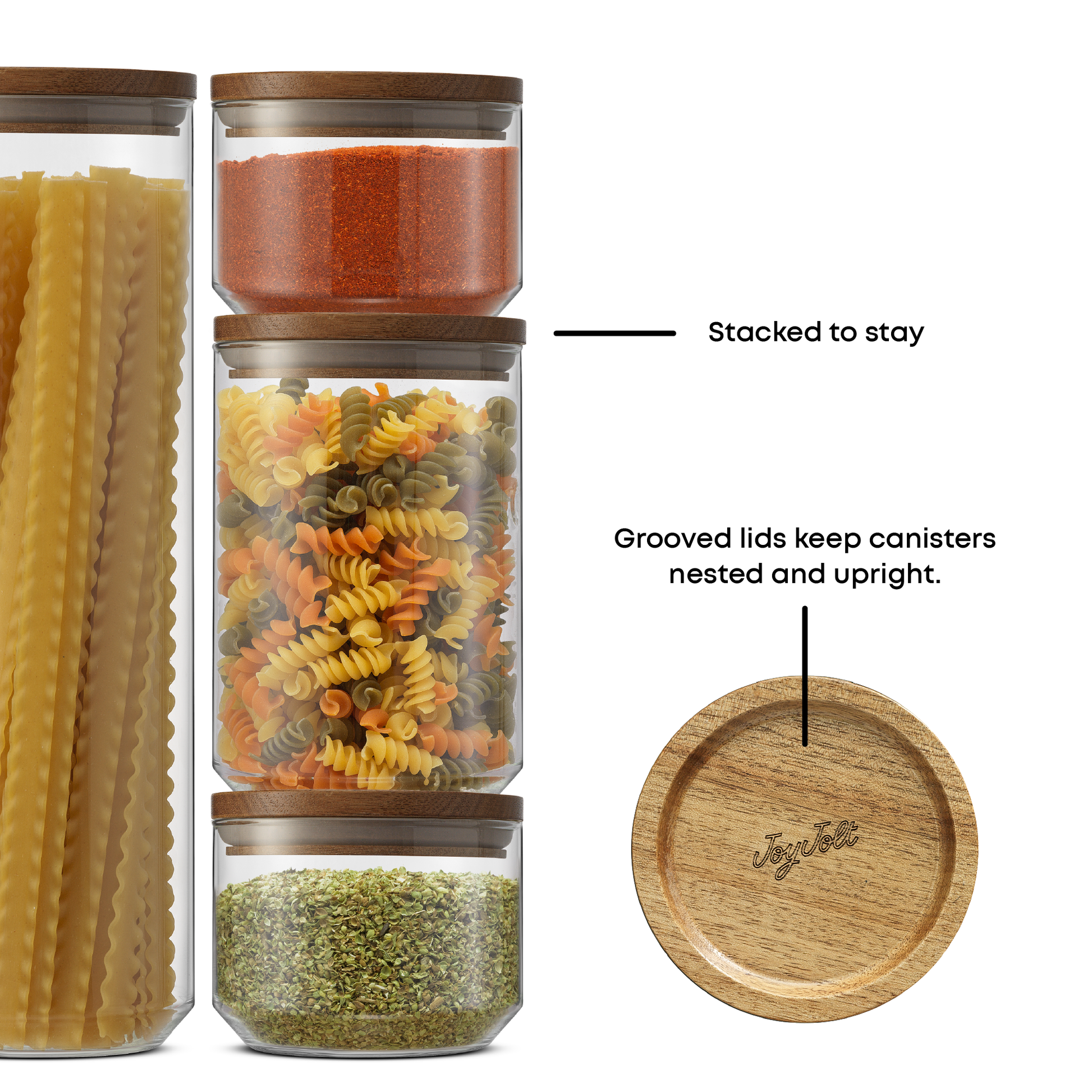 Set of glass jars with wooden lids containing different types of pasta and grains, with text indicating features: "Stacked to stay, grooved lids keep canisters nested and upright"