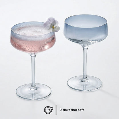 Two glass cocktails with a flower garnish on a white background, with 'Dishwasher safe' label.