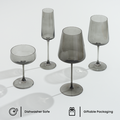 Set of smoked glass stemmed glasses on a white background with 'Dishwasher Safe' and 'Giftable Packaging' icons.