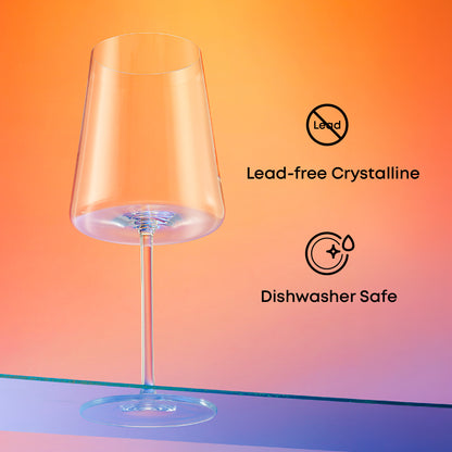 Lead-free crystalline Aura wine glass with dishwasher-safe features displayed against a warm gradient background.