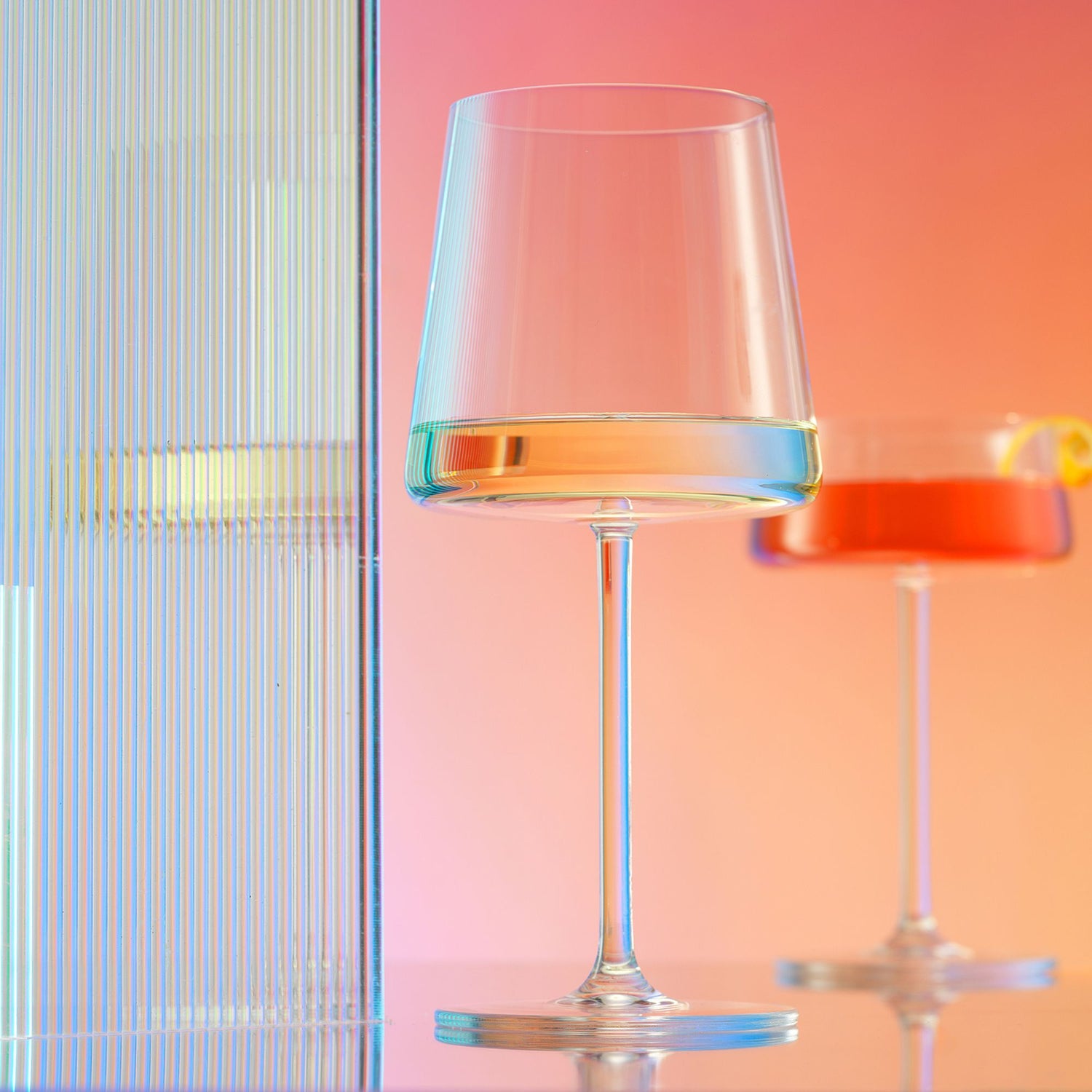 Clear white wine glass on a colorful background