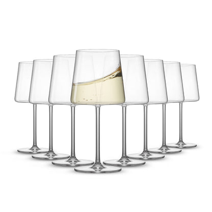 Eight clear stemmed white wine glasses arranged together on a white background, with the front glass filled with white wine.