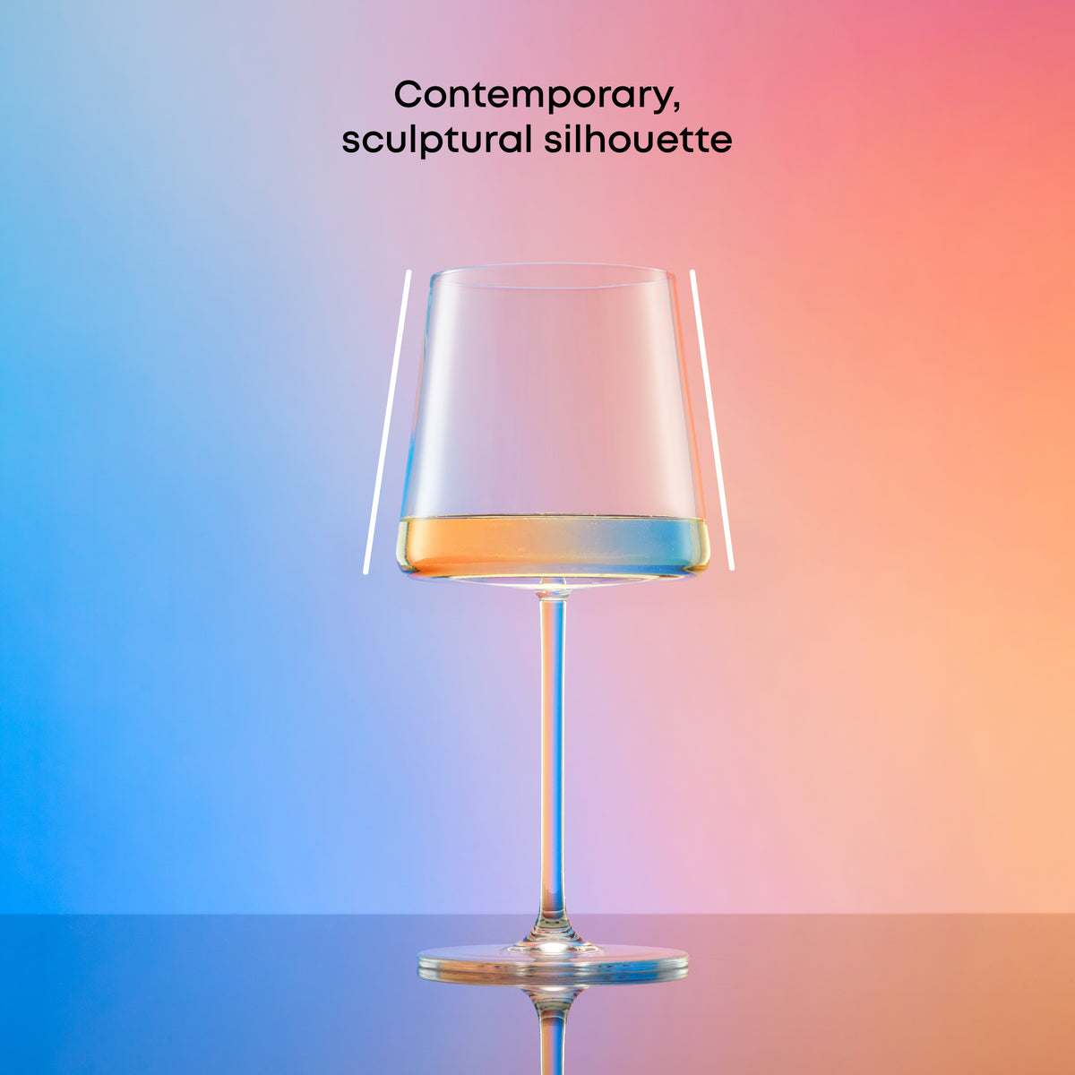 Clear stemmed white wine glass with a contemporary tapered silhouette, partially filled with white wine against a blue and coral gradient background.