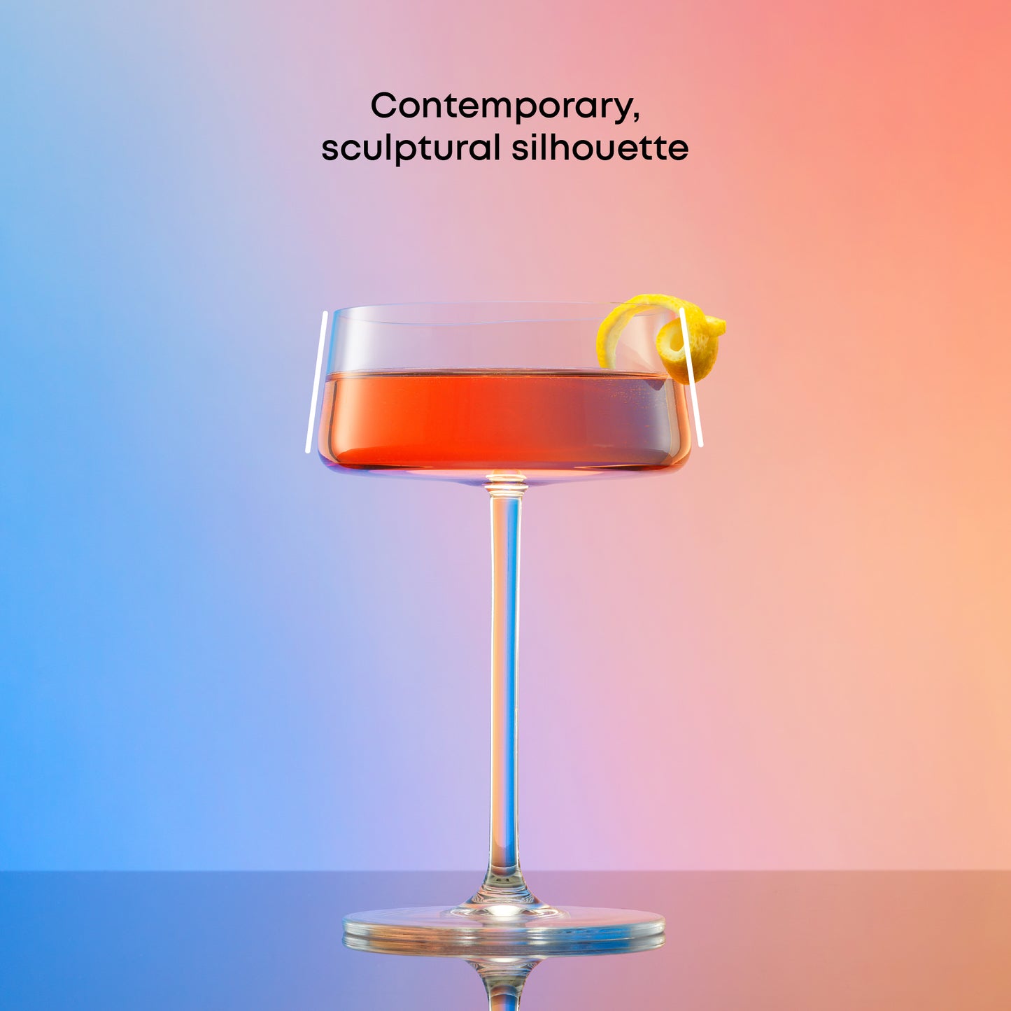 Cocktail in a glass with a lemon twist on a gradient background, showing a contemporary silhouette.