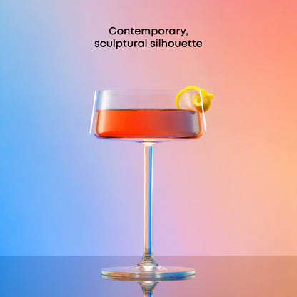 Cocktail in a glass with a lemon twist on a gradient background, showing a contemporary silhouette.