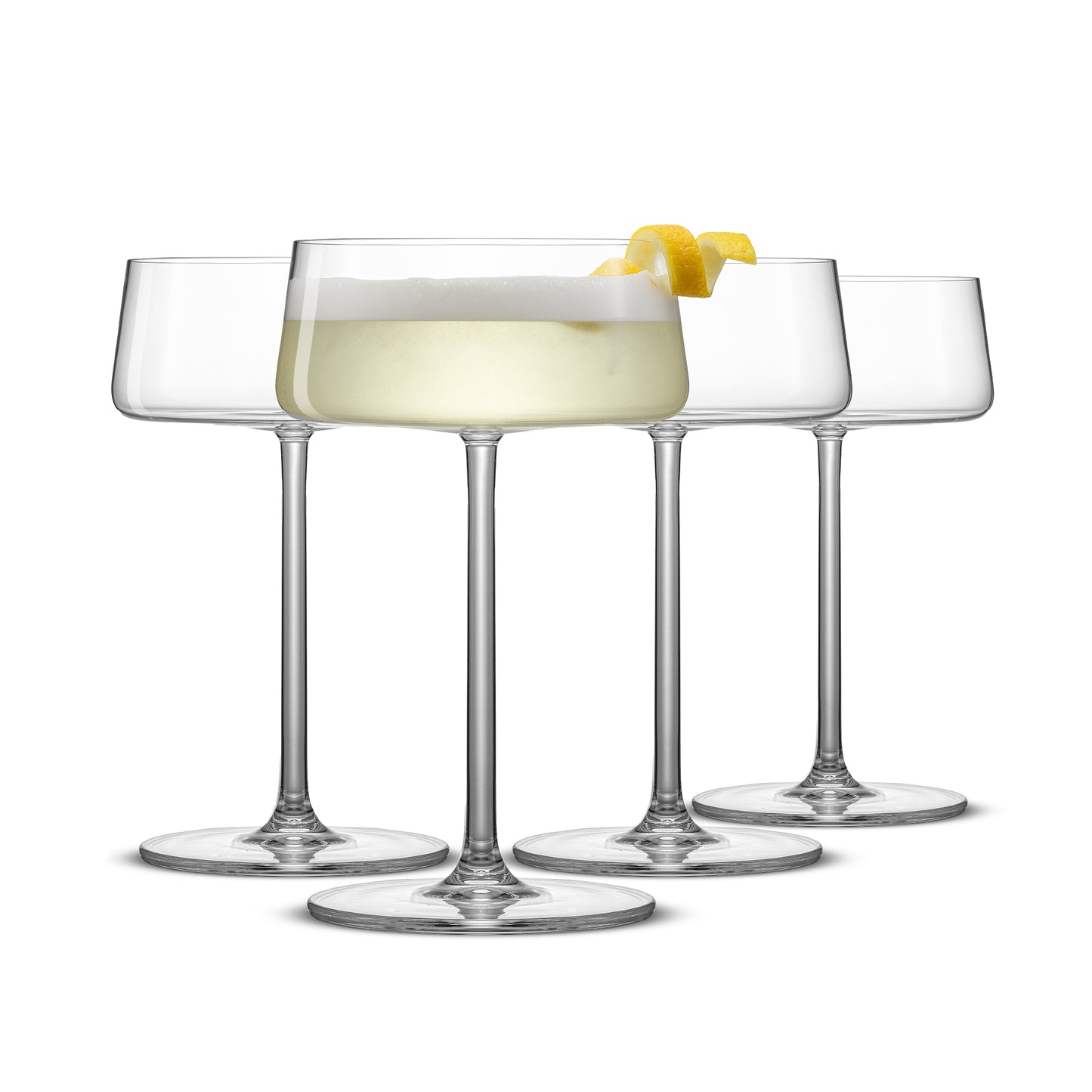 Four martini glasses lined up against a white background with the first full of a yellow drink with lemon rind. 