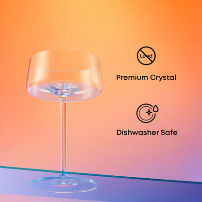 Clear martini glass with 'Premium Crystal' and 'Dishwasher Safe' icons on a gradient background