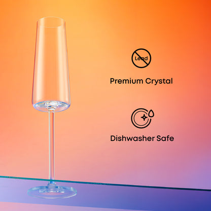 Clear champagne glass with 'Premium Crystal' and 'Dishwasher Safe' icons on a gradient background