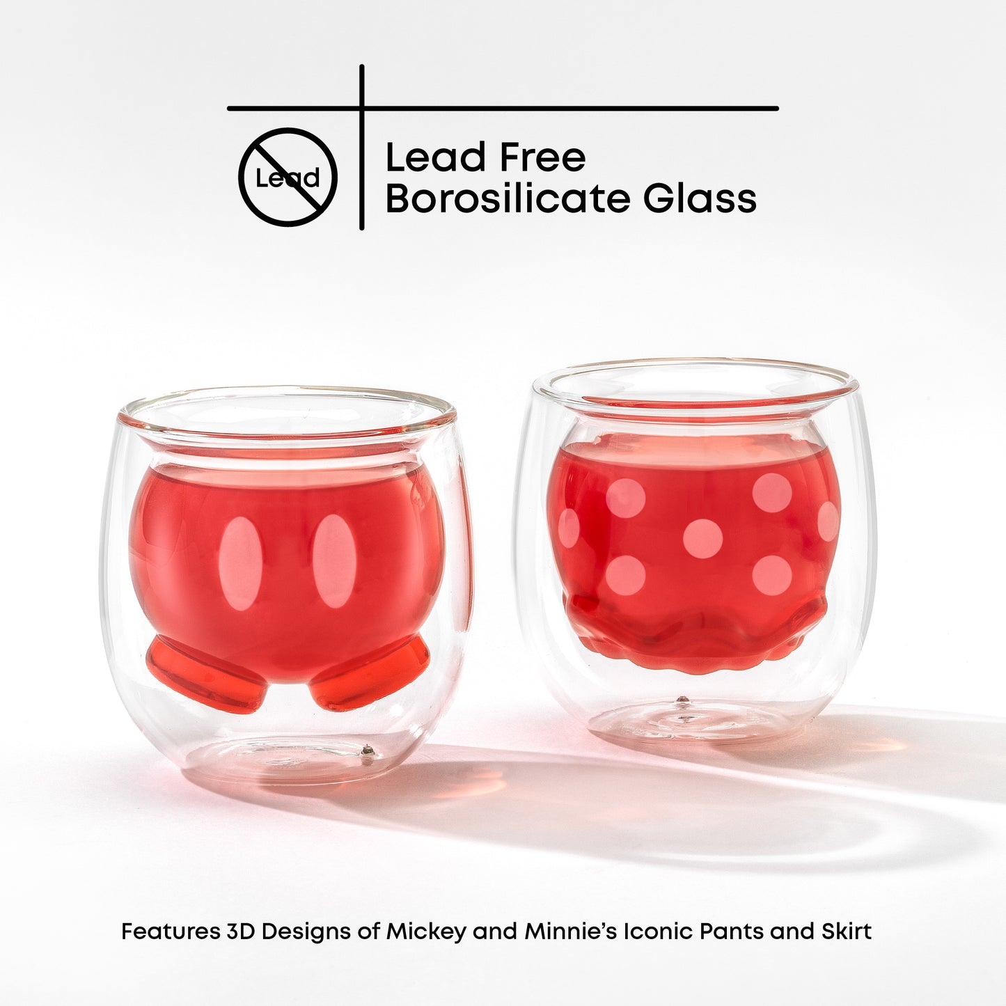 Two glass cups with a 3D double wall design featuring Mickeys pants and Minnies skirt, filled with a pink drink on a white background with text "lead free borosilicate glass"