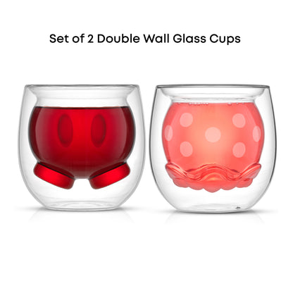 Set of two glass cups with a 3D double wall design featuring Mickeys pants and Minnies skirt, filled with a pink and red drink on a white background
