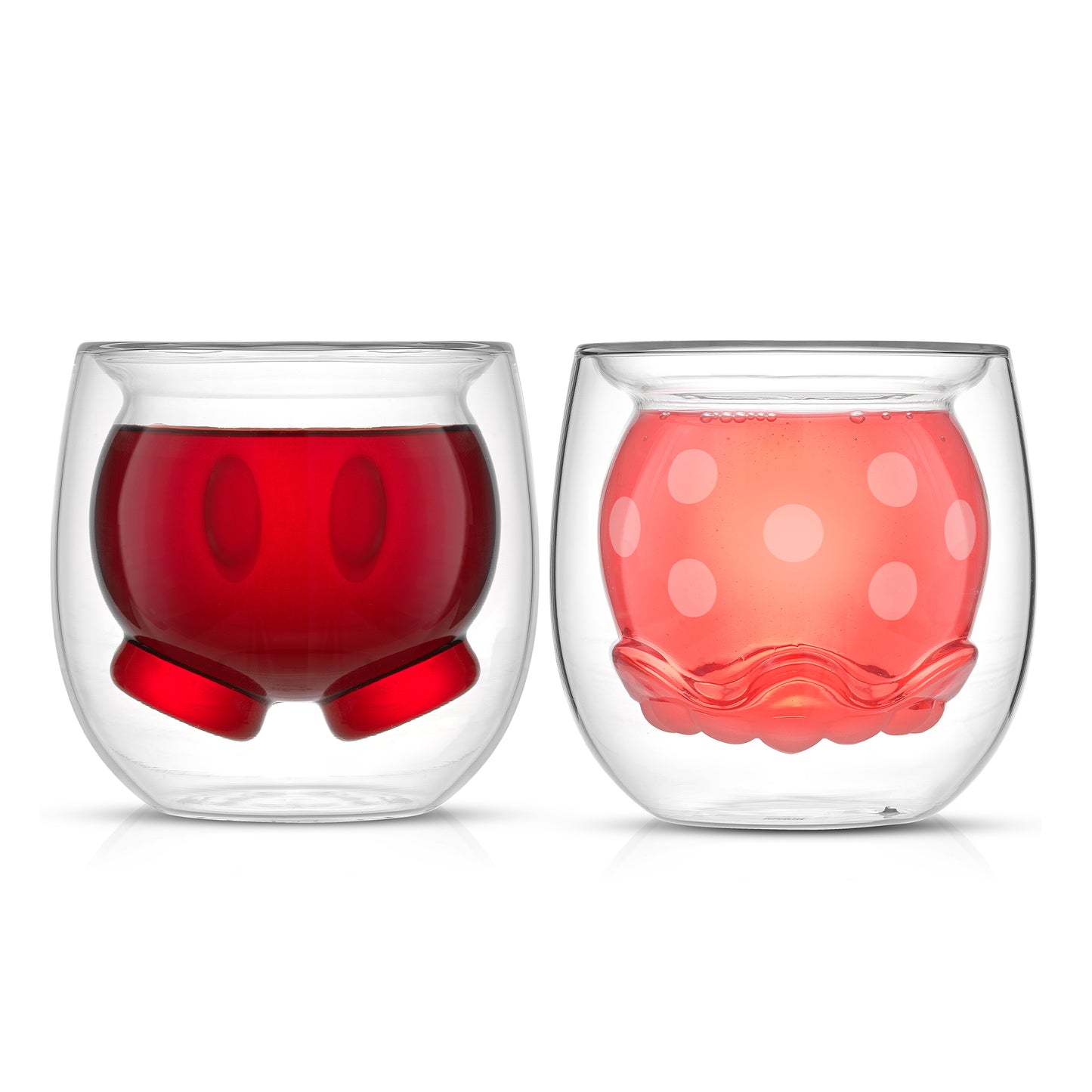 Two glass cups with a 3D double wall design featuring Mickeys pants and Minnies skirt, filled with a pink and red drink on a white background