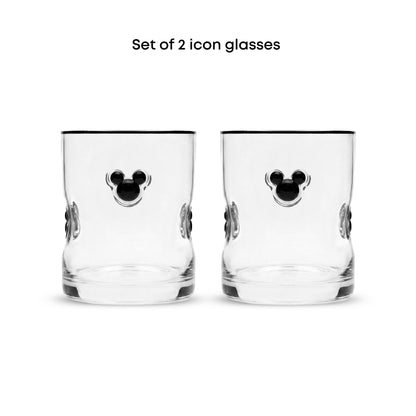 Set of 2 clear glass icon tumblers with black Mickey Mouse head designs on the front, shown on a white background with text reading 'Set of 2 icon glasses'.