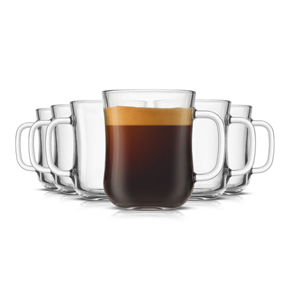 Set of six clear diner style glass mugs with handles, one filled with coffee, on a white background