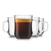 A set of four clear glass diner style coffee mugs, three are empty and one is filled with coffee.