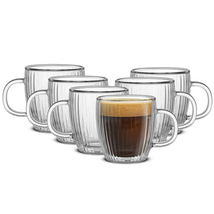 Six clear double-walled fluted espresso glasses, one filled with coffee. 