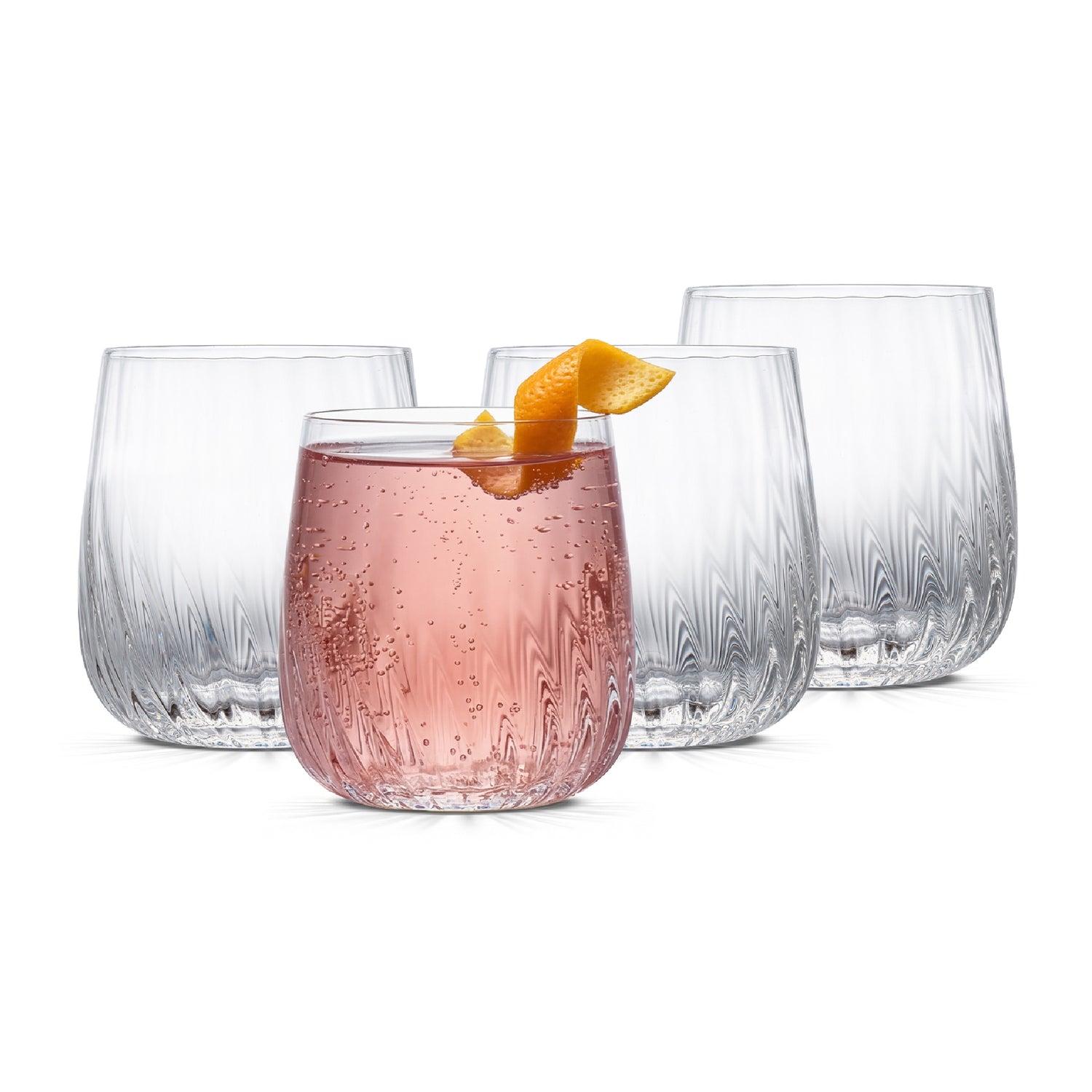 Set of four clear glass tumblers with a pink cocktail and orange slice on a white background