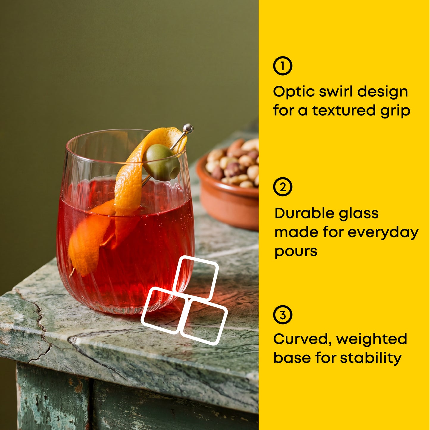 Glass with a cocktail and garnish on a wooden surface, with text about glass features.