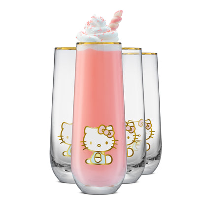 Clear flutes with a golden Hello Kitty logo and golden rims filled with pink drink and whipped cream on a white background