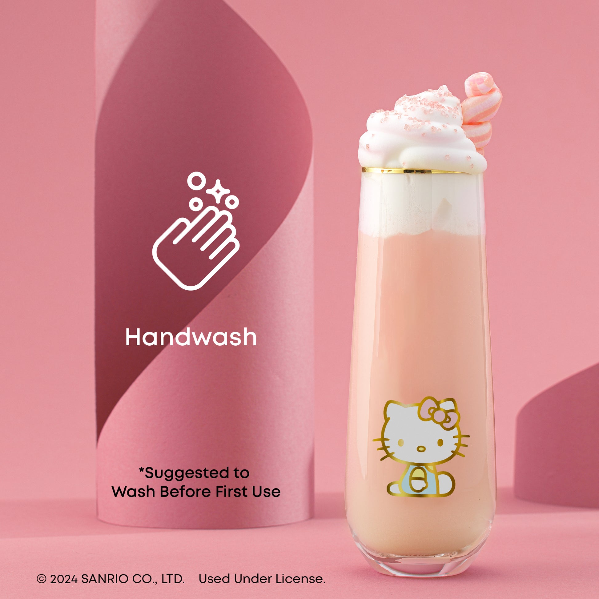 A Hello Kitty themed stemless flute filled with a pink beverage, presented against a pink backdrop, with text "handwash only, wash before first use"