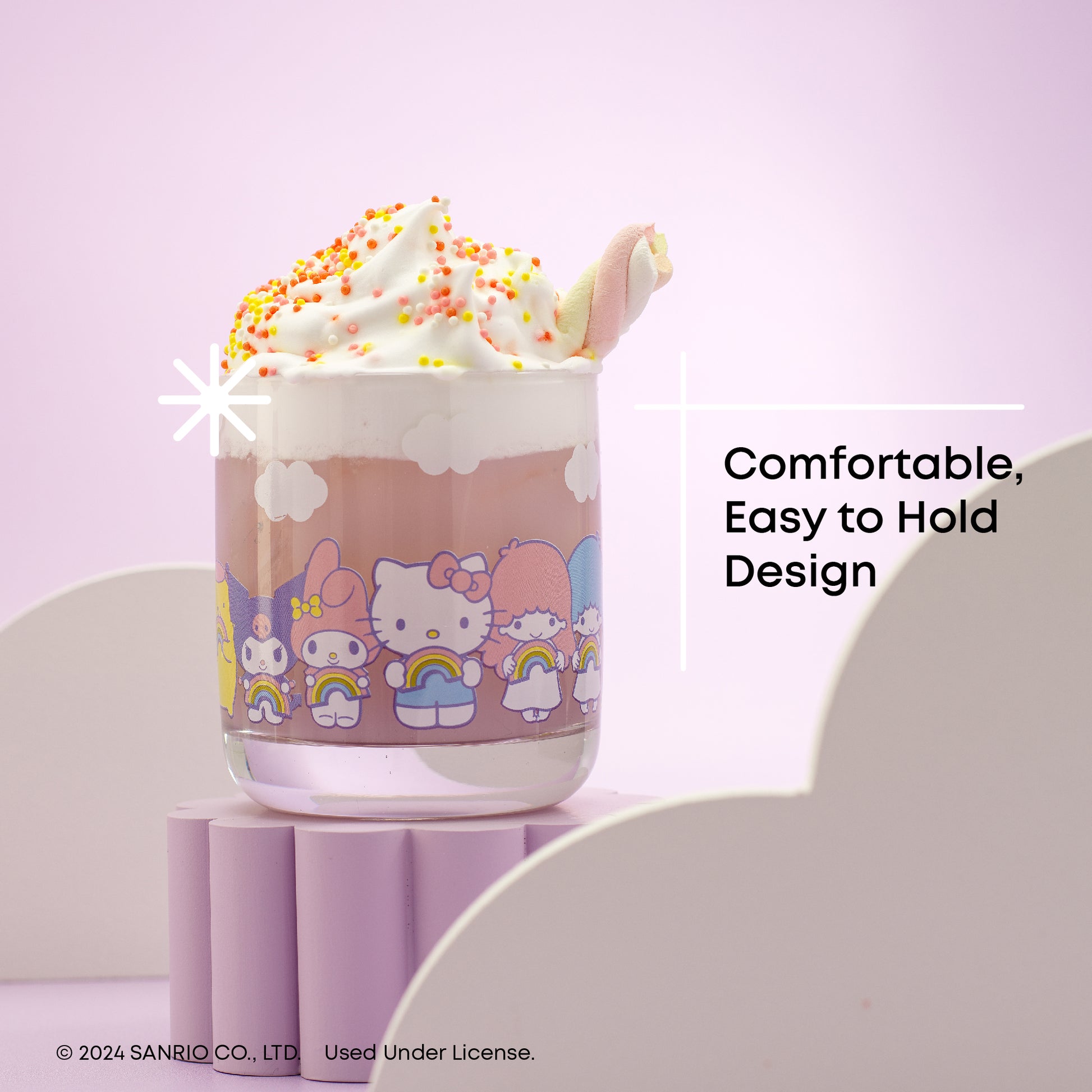 A set of four Hello Kitty themed short drinking glasses with a rainbow design, displayed against a pastel background, with text " comfortable easy to hold design"