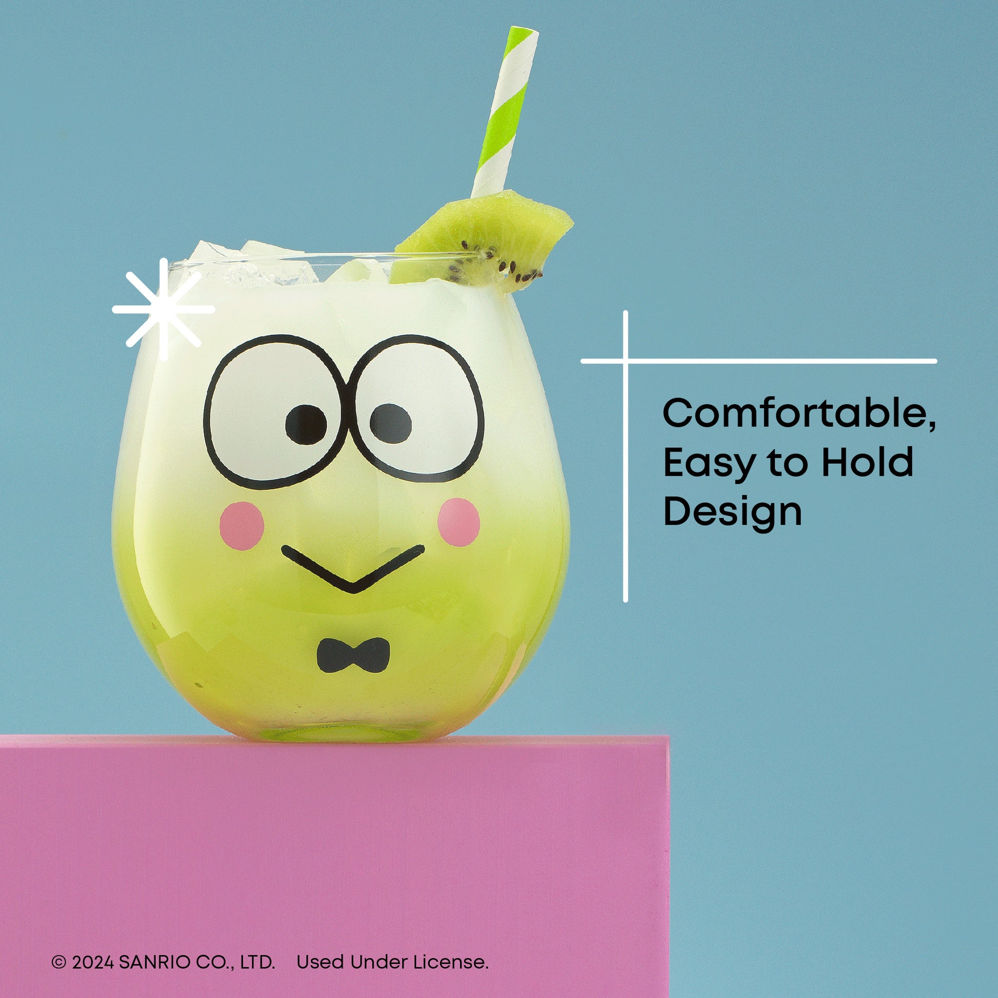 A Keropi stemless glass with a white drink inside topped with a kiwi, with text "comfortable, easy to hold design"