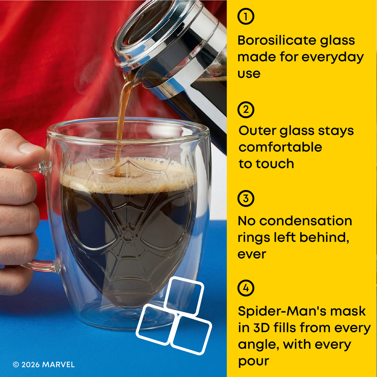 A double-walled clear glass mug with a Spider-Man web design is shown on a blue surface while coffee is being poured into it. A hand holds the mug, and a bright yellow text panel on the right lists four product features.