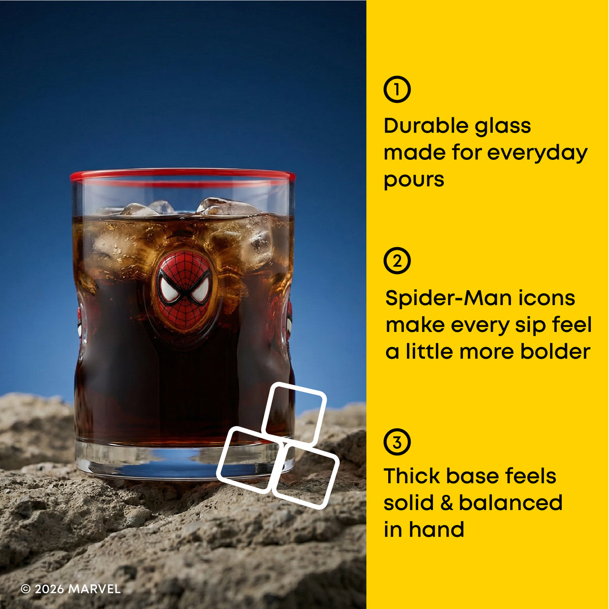 A Spider-Man themed glass tumbler filled with iced cola, shown on a rocky surface with a blue sky background and three feature callouts on a yellow panel.