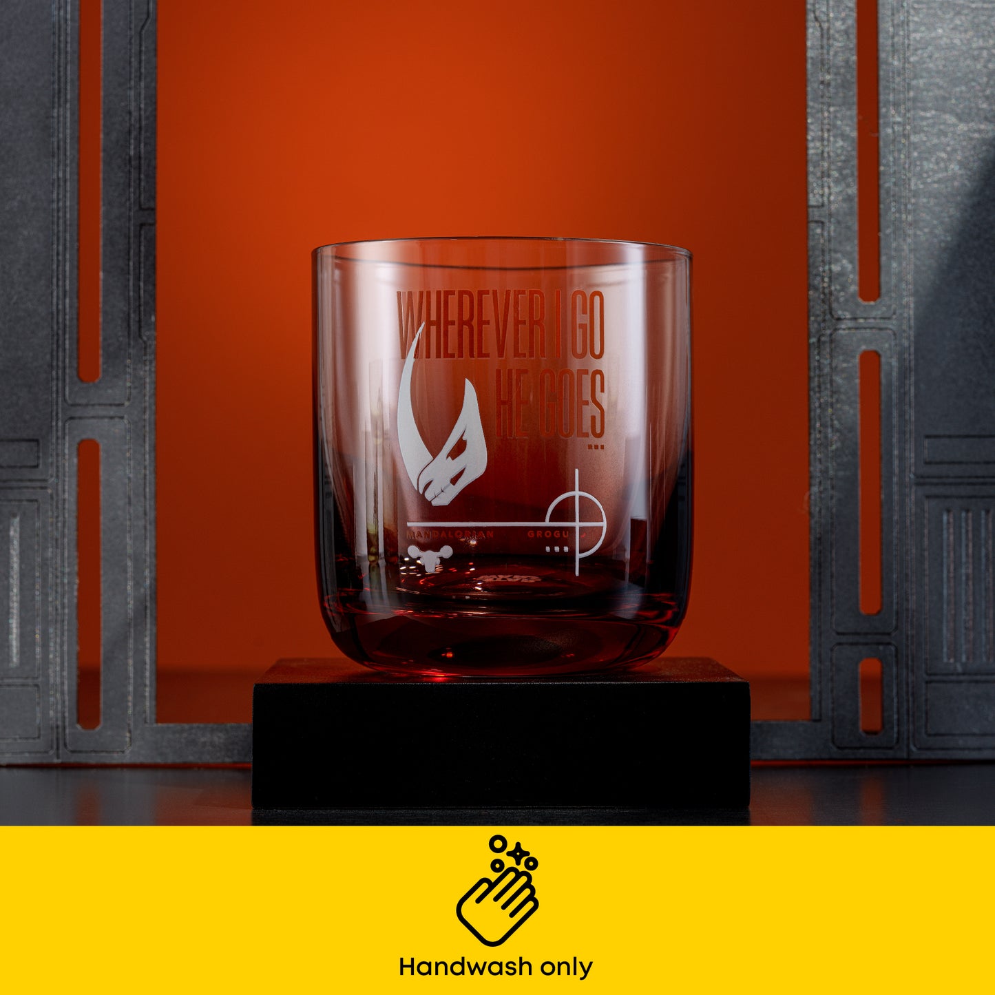 Glass with red ombre colored base and decal that says 'wherever i go he goes' with handwash only icon