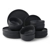 Set of black dinnerware including bowls and plates on a white background