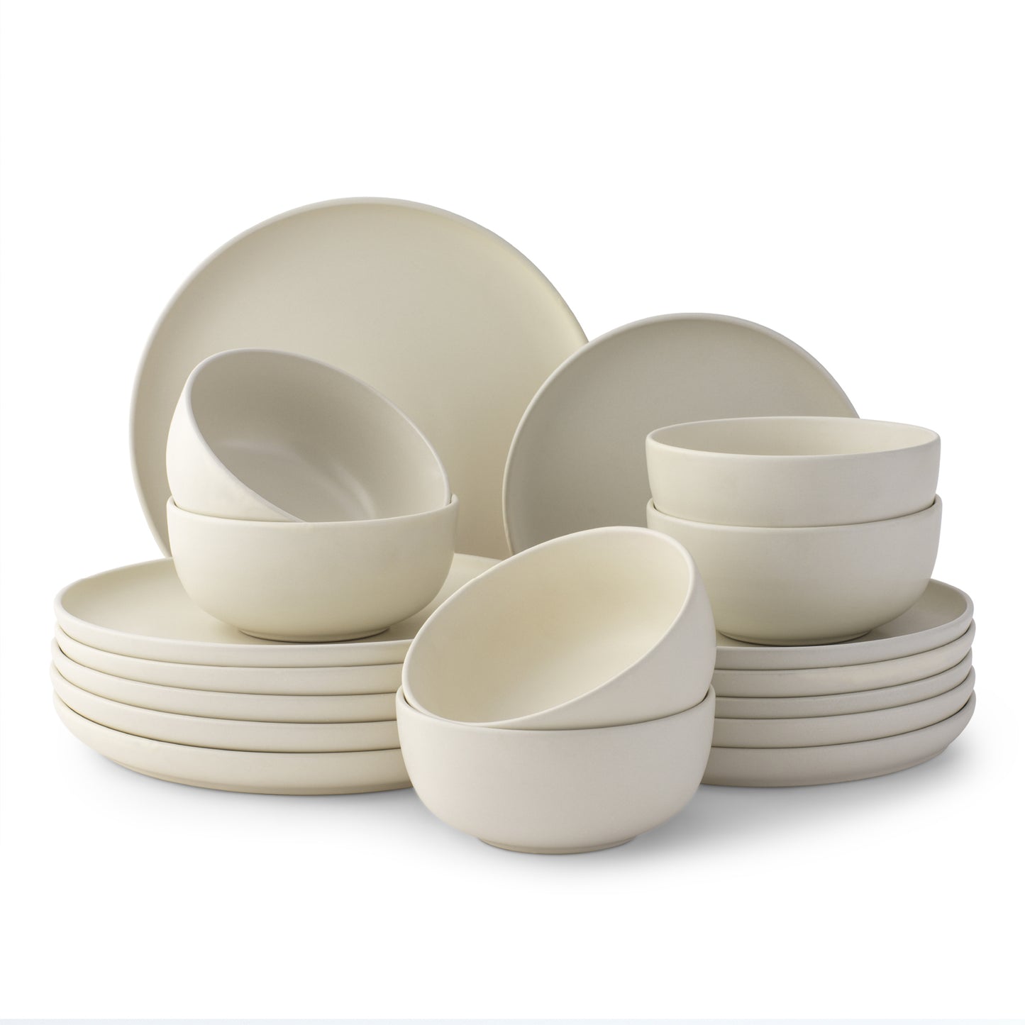 Set of white dinnerware including bowls and plates on a white background