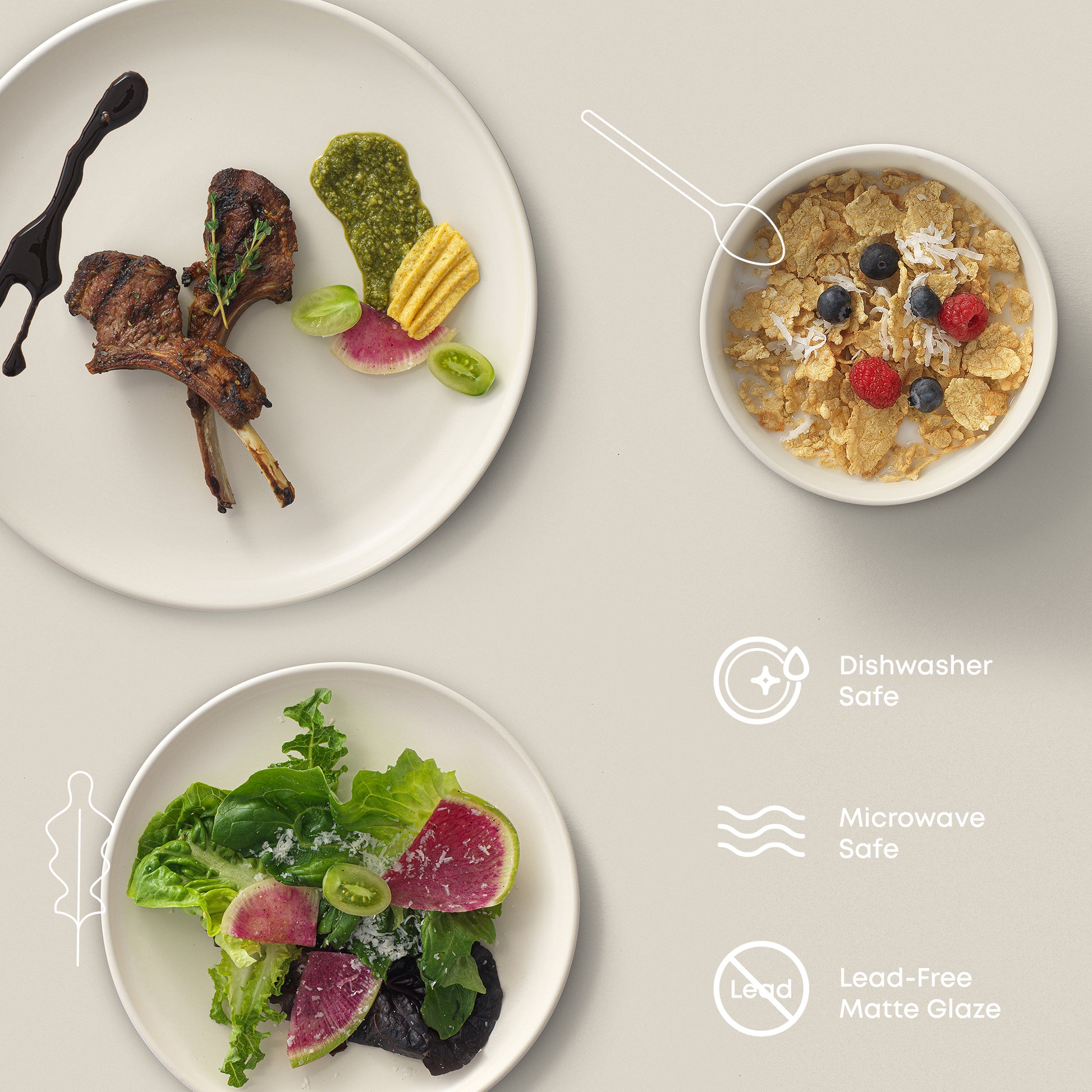 Lamb chop and veggies on a dinner plate, salad on the salad plate, and a grain bowl with berries in the cereal bowl. Text shows: "dishwasher and microwave safe, lead-free matte glaze."