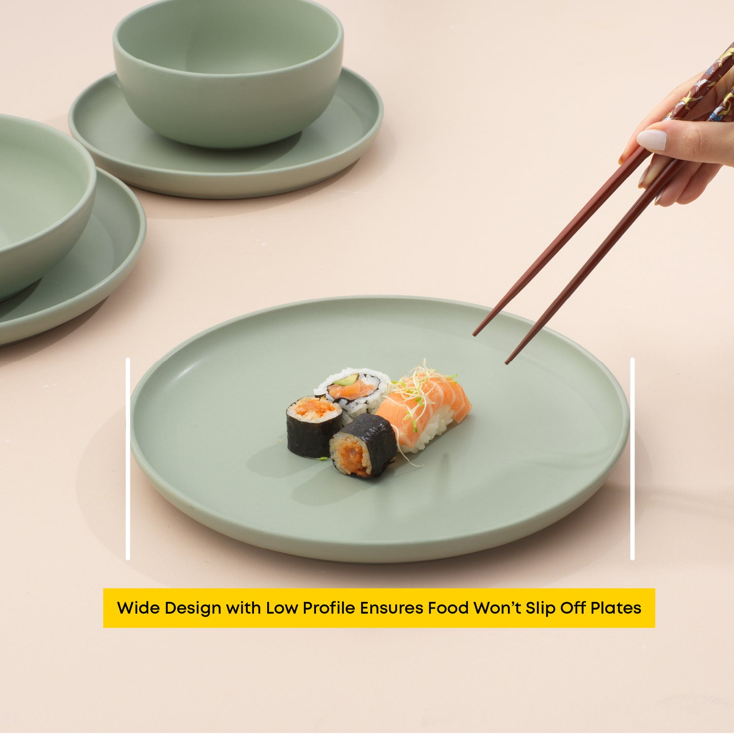 Sushi arranged on a dinner plate with a hand and chopsticks nearing to grab a piece, with text "wide design with low profile ensures food won't slip off plates."