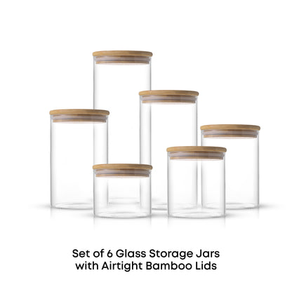 Set of 6 airtight clear glass storage jars with bamboo  lids on a white background
