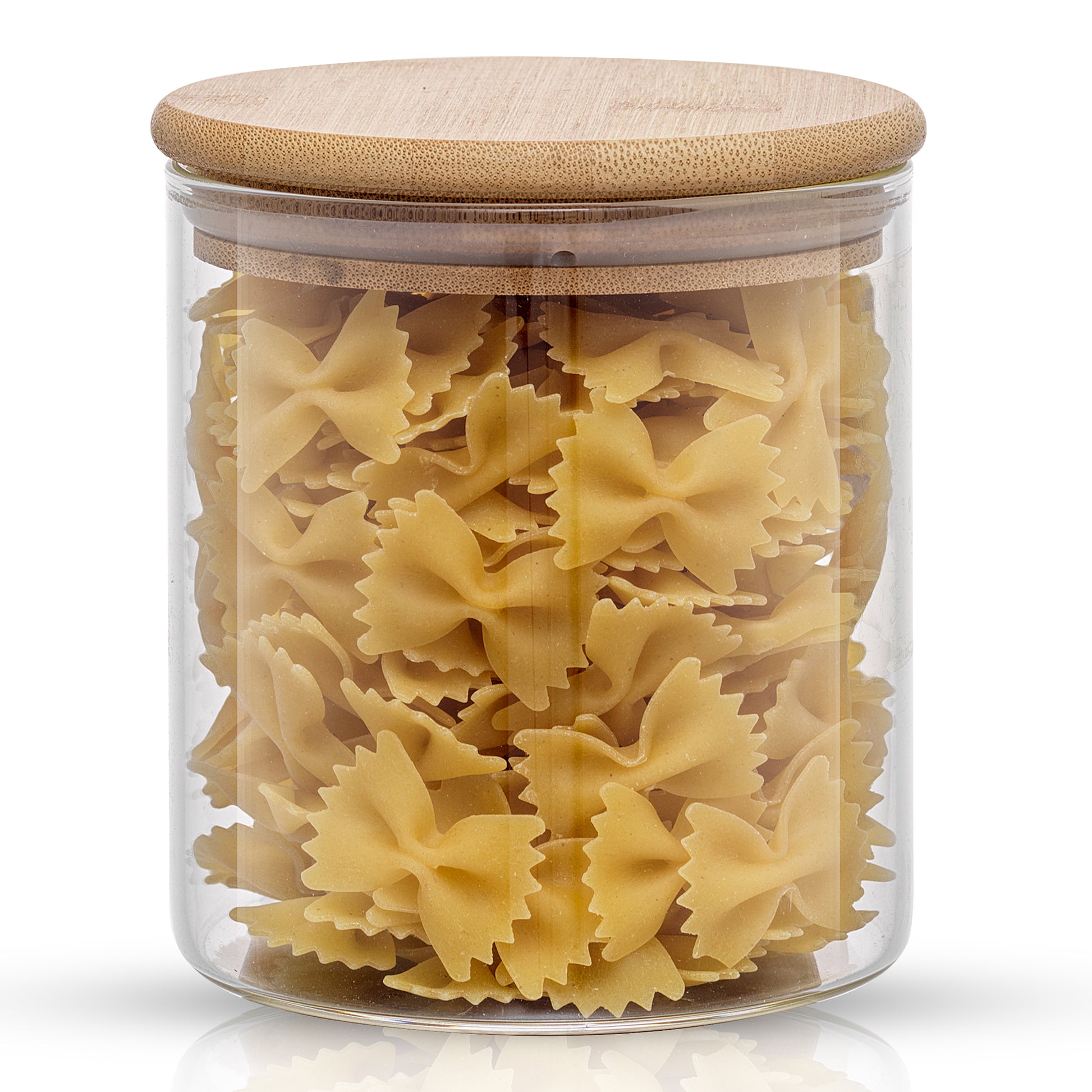 Storage jar with bamboo lid filled with farfalle pasta. 