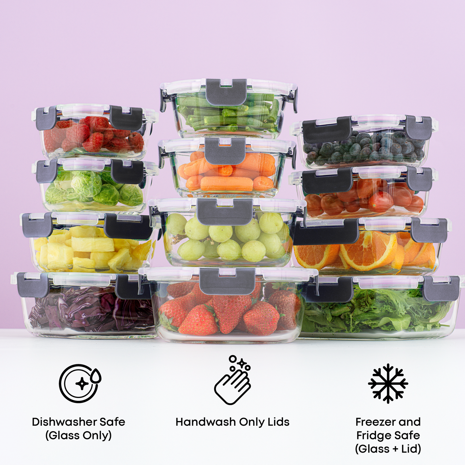Set of clear food storage containers with fruits and vegetables on a white surface with a light purple background. Text call outs: dishwasher safe glass, handwash lids, freezer + fridge safe glass/lids.
