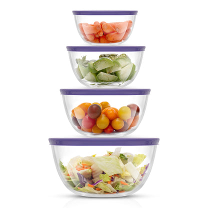Set of four glass bowls with purple lids containing various vegetables on a white background