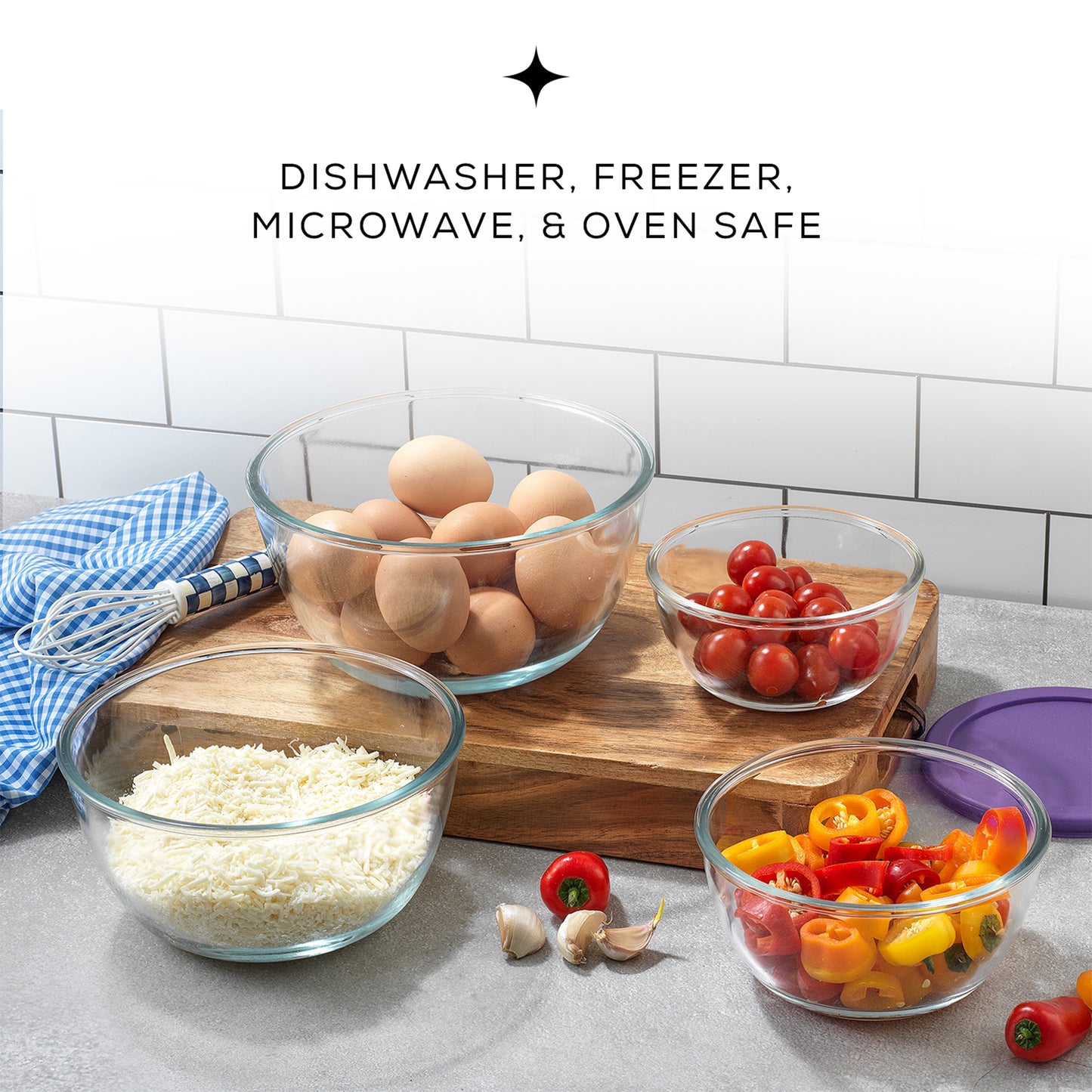 Four glass bowls filled with eggs and tomatoes sit on a table. The bowls have purple lids next to them. Text on the image reads: "DISHWASHER, FREEZER, MICROWAVE, AND OVEN SAFE"