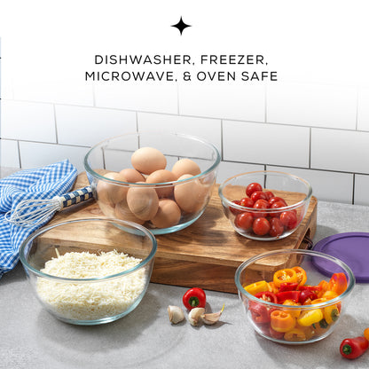 Four glass bowls filled with eggs and tomatoes sit on a table. The bowls have purple lids next to them. Text on the image reads: "DISHWASHER, FREEZER, MICROWAVE, AND OVEN SAFE"