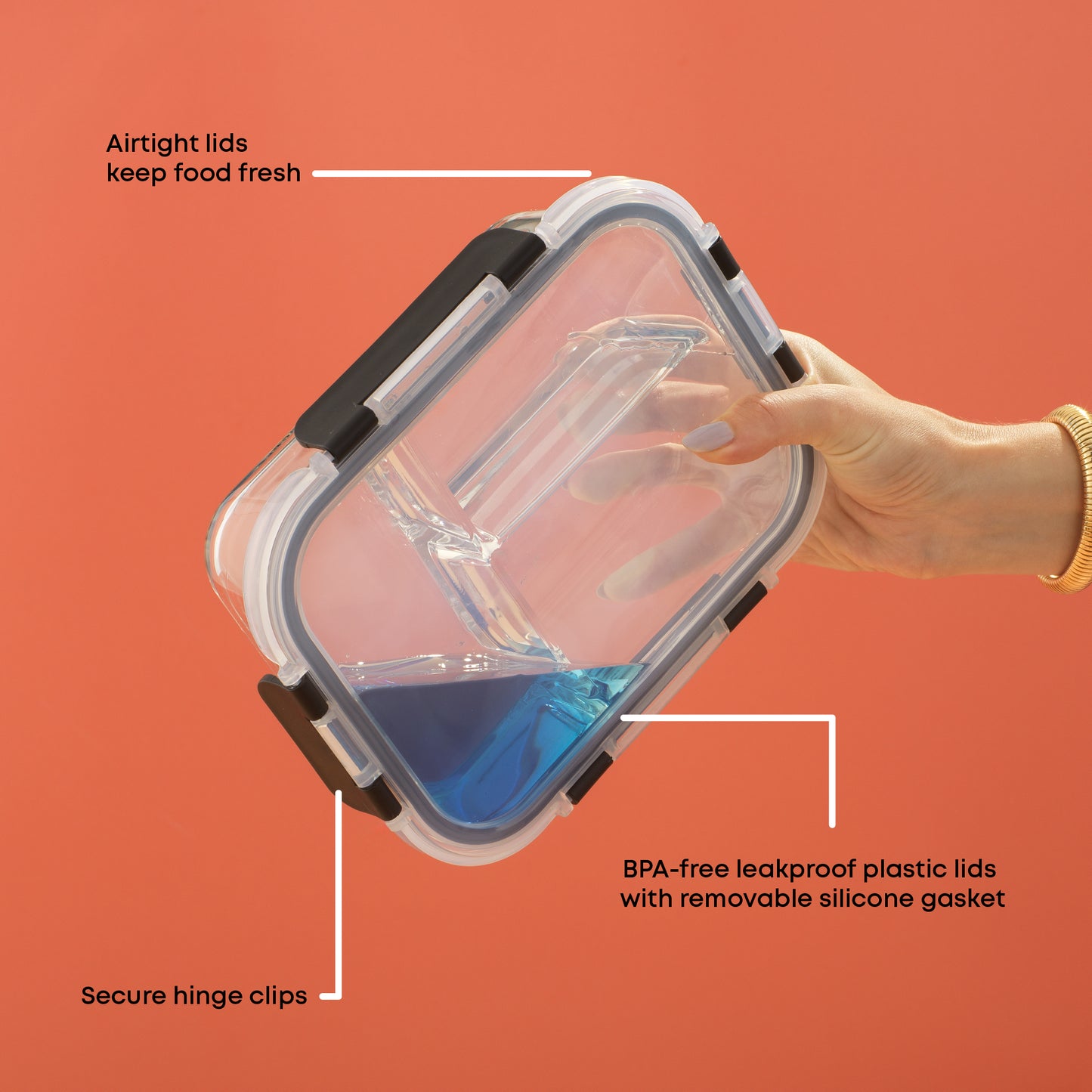 Hands holding a closed container with liquid inside, upside down, to demonstrate its leakproof feature. Text: BPA free plastic lids and removable seal, secure hinge clips, airtight.
