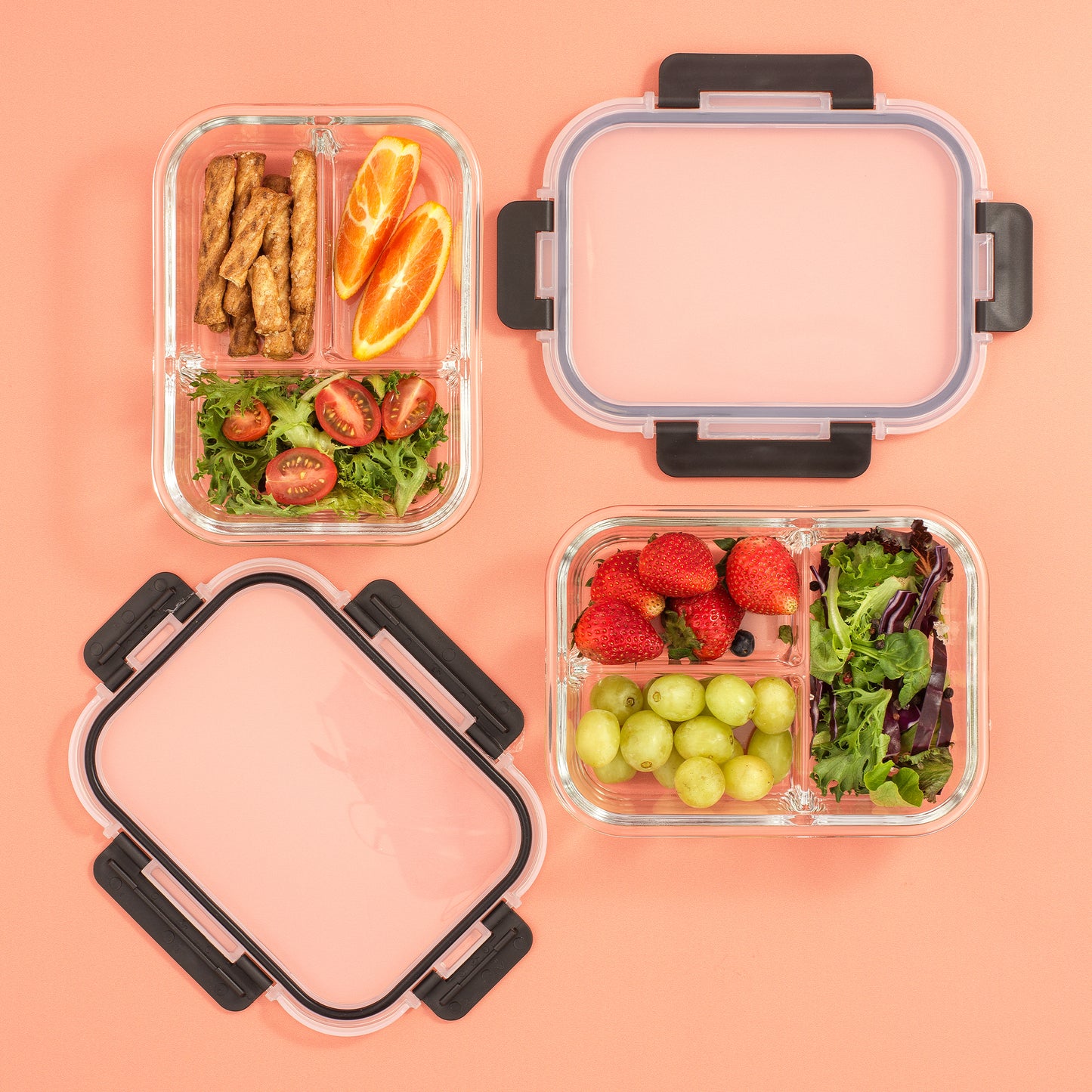 Two containers shown with different foods stored: salad, strawberries, grapes, oranges, pretzels.
