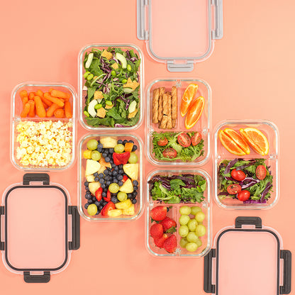 Assortment of foods stored in containers: salad, pretzel, popcorn, fruit.