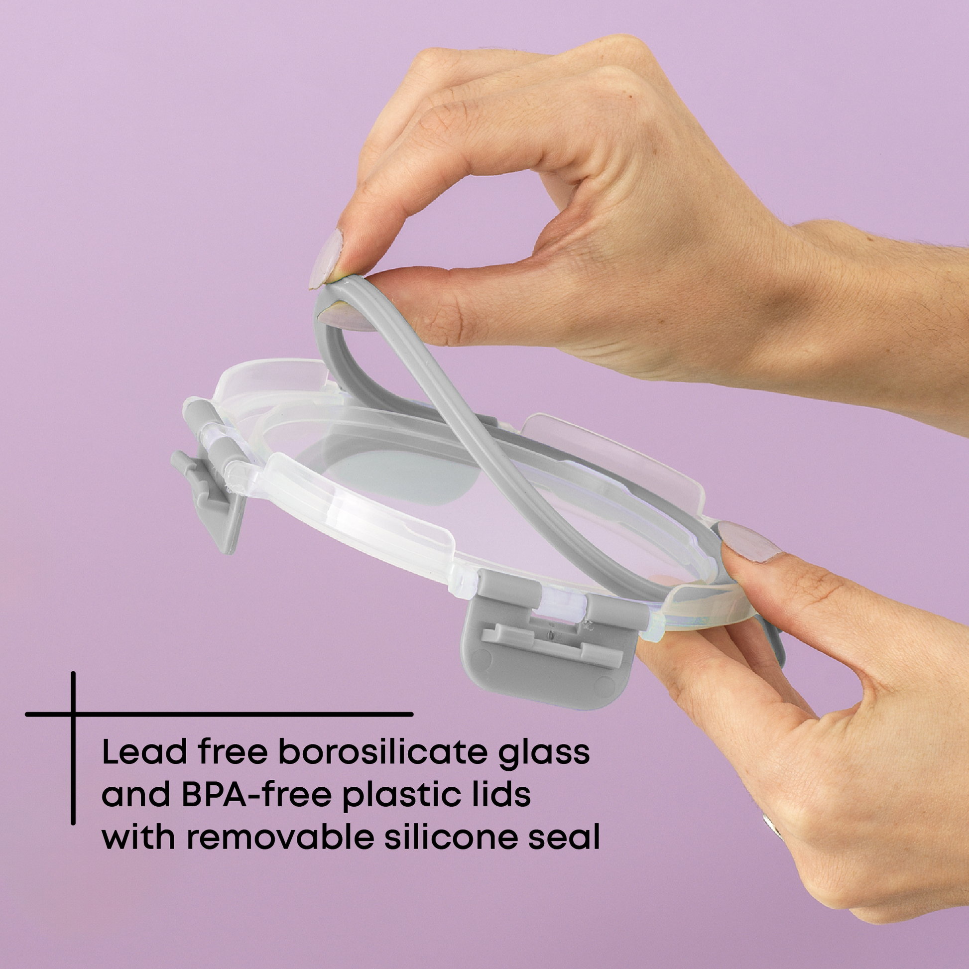 Hands holding a BPA-free plastic lid with a removable silicone seal against a purple background