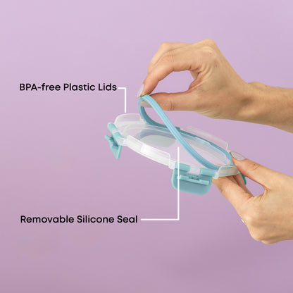 Hands holding a BPA-free plastic lid with a removable silicone seal against a purple background