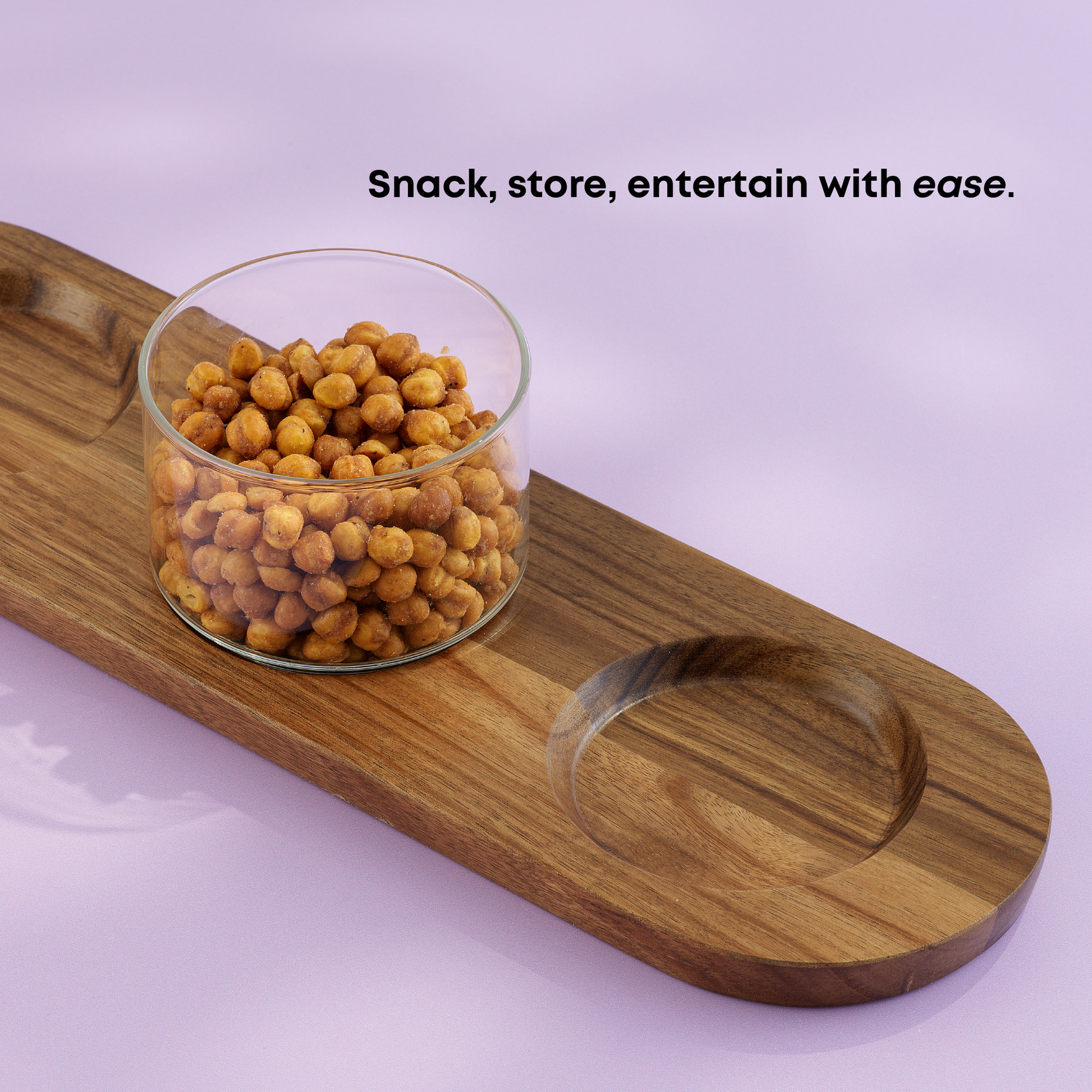 Wooden tray with a glass container with chickpeas inside on a light purple background