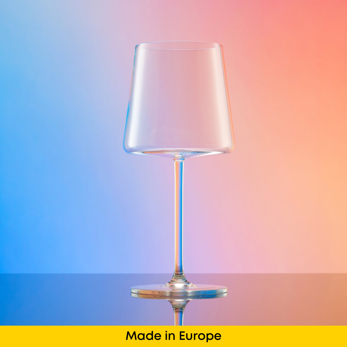 European-made crystal wine glass with contemporary tapered bowl, long stem, and rounded foot.